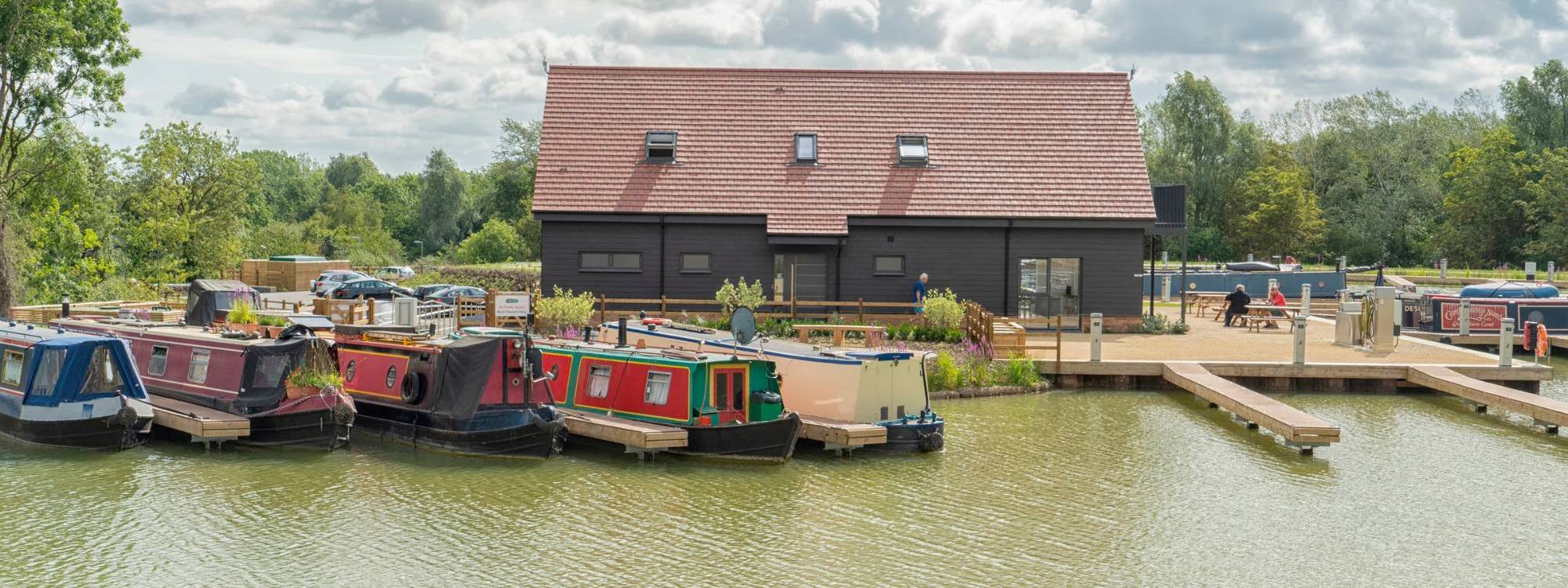 Canal boats with reception building behind